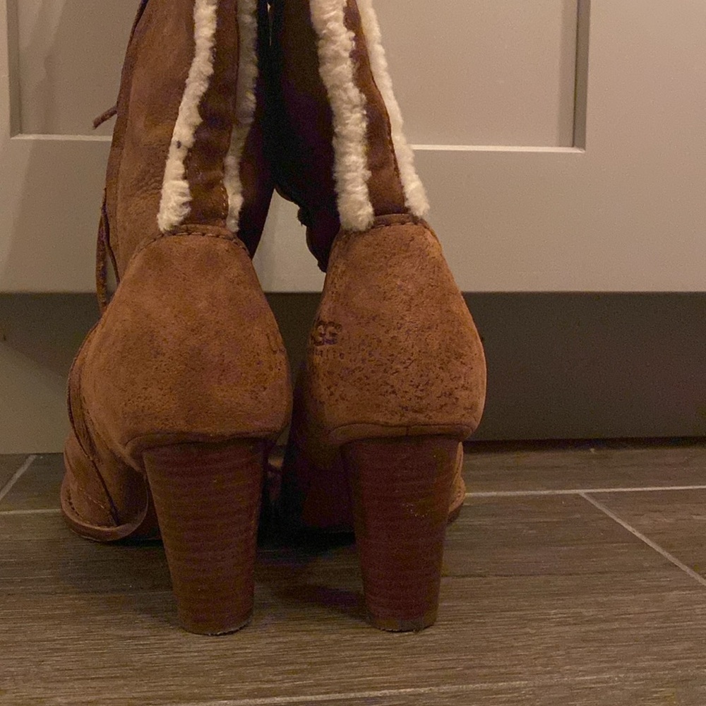 Cute laced tall brown UGG boots.